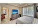 A tastefully decorated bedroom offers neutral decor, a ceiling fan, and lots of natural light at 1000 San Lino Cir # 1034, Venice, FL 34292