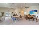 Bright clubhouse featuring ceiling fans, comfortable seating, and access to the outdoor pool area at 1000 San Lino Cir # 1034, Venice, FL 34292