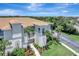 A charming three-story condo building with lush landscaping and beautiful architectural details at 1000 San Lino Cir # 1034, Venice, FL 34292