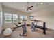 Well-equipped fitness room featuring exercise equipment, window views, and ample space at 1000 San Lino Cir # 1034, Venice, FL 34292