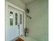 Inviting front door with decorative details, house number, and a welcoming accent piece at 1000 San Lino Cir # 1034, Venice, FL 34292