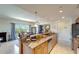 Open-concept kitchen with granite counters, a breakfast bar, and seamless transition to the dining area at 1000 San Lino Cir # 1034, Venice, FL 34292