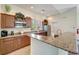 Clubhouse kitchen featuring granite countertops, stainless steel appliances, and ample cabinet space at 1000 San Lino Cir # 1034, Venice, FL 34292
