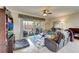 Cozy living room featuring tile floors, comfortable seating, and a serene view of the outdoors at 1000 San Lino Cir # 1034, Venice, FL 34292