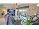 Inviting living room with comfortable seating, a ceiling fan, and a seamless flow to the outdoor area at 1000 San Lino Cir # 1034, Venice, FL 34292