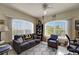 A sunlit living room has large windows offering lots of natural light and outdoor views at 1000 San Lino Cir # 1034, Venice, FL 34292