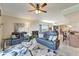 Open-concept living area with hardwood floors, natural light, and stylish furniture at 1000 San Lino Cir # 1034, Venice, FL 34292