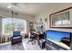 A bright home office with a built-in desk, large windows, and lots of natural light at 1000 San Lino Cir # 1034, Venice, FL 34292