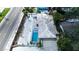 Aerial view of single-story home with a pool, shell yard, and convenient access to the beach at 1201 Big Oak Ln, Sarasota, FL 34242