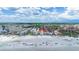 Aerial view of a coastal neighborhood highlighting the beach and nearby buildings at 1201 Big Oak Ln, Sarasota, FL 34242
