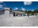 A private backyard featuring a swimming pool, shell ground cover, and seating area at 1201 Big Oak Ln, Sarasota, FL 34242