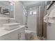 Modern bathroom featuring a stylish vanity, sleek fixtures, and a shower with a curtain at 1201 Big Oak Ln, Sarasota, FL 34242