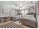 Bedroom with two beds, ceiling fan, and writing desk at 1201 Big Oak Ln, Sarasota, FL 34242