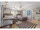 Bedroom with two beds, ceiling fan, and decorative carpet at 1201 Big Oak Ln, Sarasota, FL 34242
