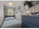 Charming bedroom with nautical decor, built-in storage, and lots of natural light at 1201 Big Oak Ln, Sarasota, FL 34242