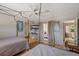 Bedroom featuring two beds, TV, and direct access to the outdoor patio at 1201 Big Oak Ln, Sarasota, FL 34242
