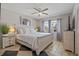Cozy bedroom featuring a ceiling fan, a comfortable bed, and views of the community at 1201 Big Oak Ln, Sarasota, FL 34242