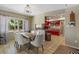 Dining room with view into the kitchen at 1201 Big Oak Ln, Sarasota, FL 34242