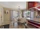 Bright dining area with views to the screened in porch and canal at 1201 Big Oak Ln, Sarasota, FL 34242