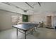 Fun game room with a ping pong table and large window with natural light at 1201 Big Oak Ln, Sarasota, FL 34242
