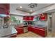 Well-lit kitchen features granite countertops and stainless steel appliances at 1201 Big Oak Ln, Sarasota, FL 34242