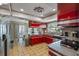 Open kitchen with views to dining area and stainless steel appliances at 1201 Big Oak Ln, Sarasota, FL 34242