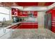 Bright kitchen with granite countertops and stainless steel appliances at 1201 Big Oak Ln, Sarasota, FL 34242