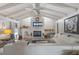 Bright living room featuring vaulted ceilings, fireplace, and comfortable seating at 1201 Big Oak Ln, Sarasota, FL 34242