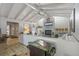 Bright living room featuring vaulted ceilings, fireplace, and comfortable seating at 1201 Big Oak Ln, Sarasota, FL 34242