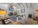 Bright living room with vaulted ceilings, fireplace, and TV at 1201 Big Oak Ln, Sarasota, FL 34242