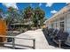 Waterfront patio with multiple chairs and a view of the neighboring home at 1201 Big Oak Ln, Sarasota, FL 34242