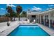 Inviting pool with lounge area and multiple seating options at 1201 Big Oak Ln, Sarasota, FL 34242