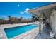 Inviting outdoor swimming pool with a spacious patio and sunny sky at 1201 Big Oak Ln, Sarasota, FL 34242