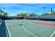 Outdoor community basketball court with well-maintained surface, nets, and sports lighting at 1251 Burgos Dr # 303, Sarasota, FL 34238