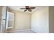 A light and airy bedroom features plantation shutters for optimal light control at 1251 Burgos Dr # 303, Sarasota, FL 34238