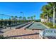 Outdoor bocce ball courts with brick pavers and palm trees provide community recreation at 1251 Burgos Dr # 303, Sarasota, FL 34238