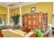 Clubhouse interior showcasing comfortable seating, a beautiful hutch, and tasteful decor at 1251 Burgos Dr # 303, Sarasota, FL 34238