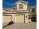 Inviting two-story townhome boasts a well-manicured lawn and charming two-car garage at 1251 Burgos Dr # 303, Sarasota, FL 34238