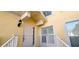 Welcoming home front entrance with a well-maintained exterior, steps, and storm door at 1251 Burgos Dr # 303, Sarasota, FL 34238