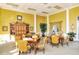 Spacious game room with tables, seating, and decor; perfect for socializing and activities at 1251 Burgos Dr # 303, Sarasota, FL 34238