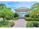 Lakeside gazebo surrounded by lush landscaping providing a serene and scenic view of the community at 1251 Burgos Dr # 303, Sarasota, FL 34238