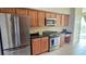 Well-equipped kitchen featuring stainless steel appliances and stylish dark countertops at 1251 Burgos Dr # 303, Sarasota, FL 34238