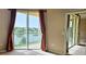 Inviting living room with sliding glass doors leading to a balcony, perfect for relaxation at 1251 Burgos Dr # 303, Sarasota, FL 34238