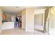 Open-concept living space showcasing kitchen, dining, and lounging areas in a naturally lit open plan at 1251 Burgos Dr # 303, Sarasota, FL 34238