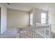 Bright loft area with plush carpeting, neutral walls, and elegant white railing and trim at 1251 Burgos Dr # 303, Sarasota, FL 34238
