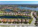 Stunning aerial view of the community featuring a lake, and lovely homes in a desirable neighborhood at 13026 Ramblewood Trl, Bradenton, FL 34211