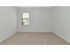 Neutral bedroom with a window and carpet at 13026 Ramblewood Trl, Bradenton, FL 34211