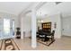 Elegant dining room features neutral tile flooring, a dark wood table and an open floor plan at 13026 Ramblewood Trl, Bradenton, FL 34211