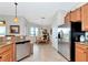 Light-filled kitchen with stainless appliances and attached eat-in nook with a round table at 13026 Ramblewood Trl, Bradenton, FL 34211
