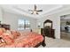 This main bedroom features a large bed and plenty of natural light at 13026 Ramblewood Trl, Bradenton, FL 34211